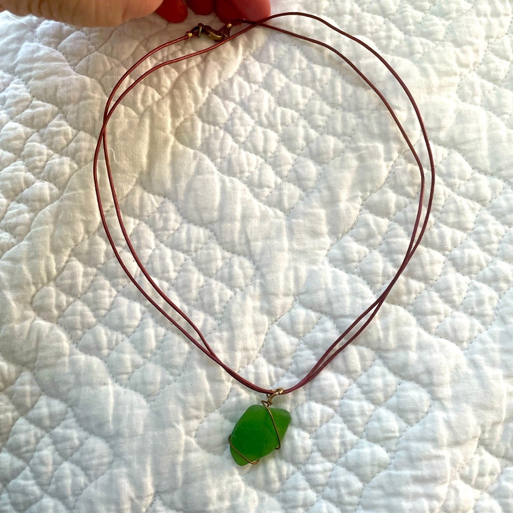 So unique! Double leather strand necklace with green sea glass.